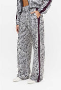 Calça wide leg estampada com faixa lateral e bolsos Instinto