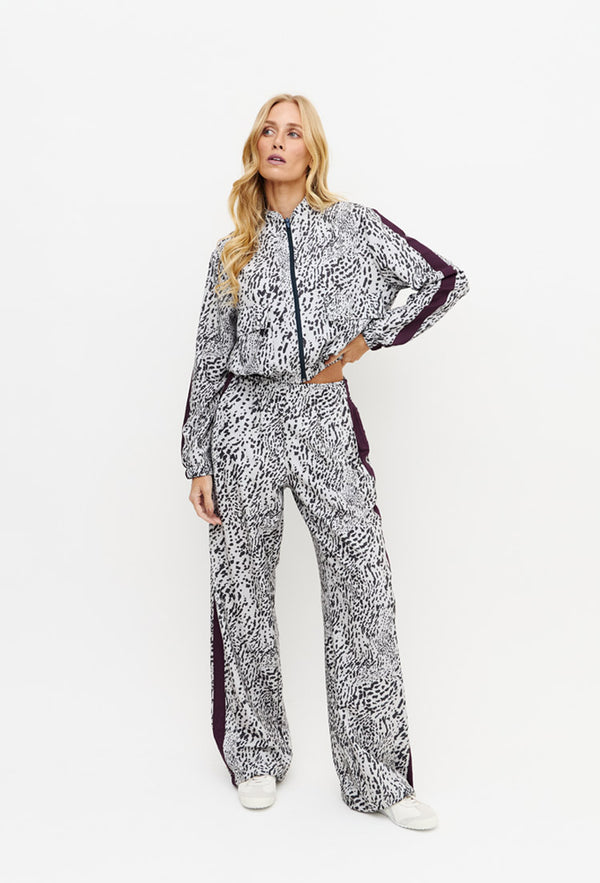 Calça wide leg estampada com faixa lateral e bolsos Instinto