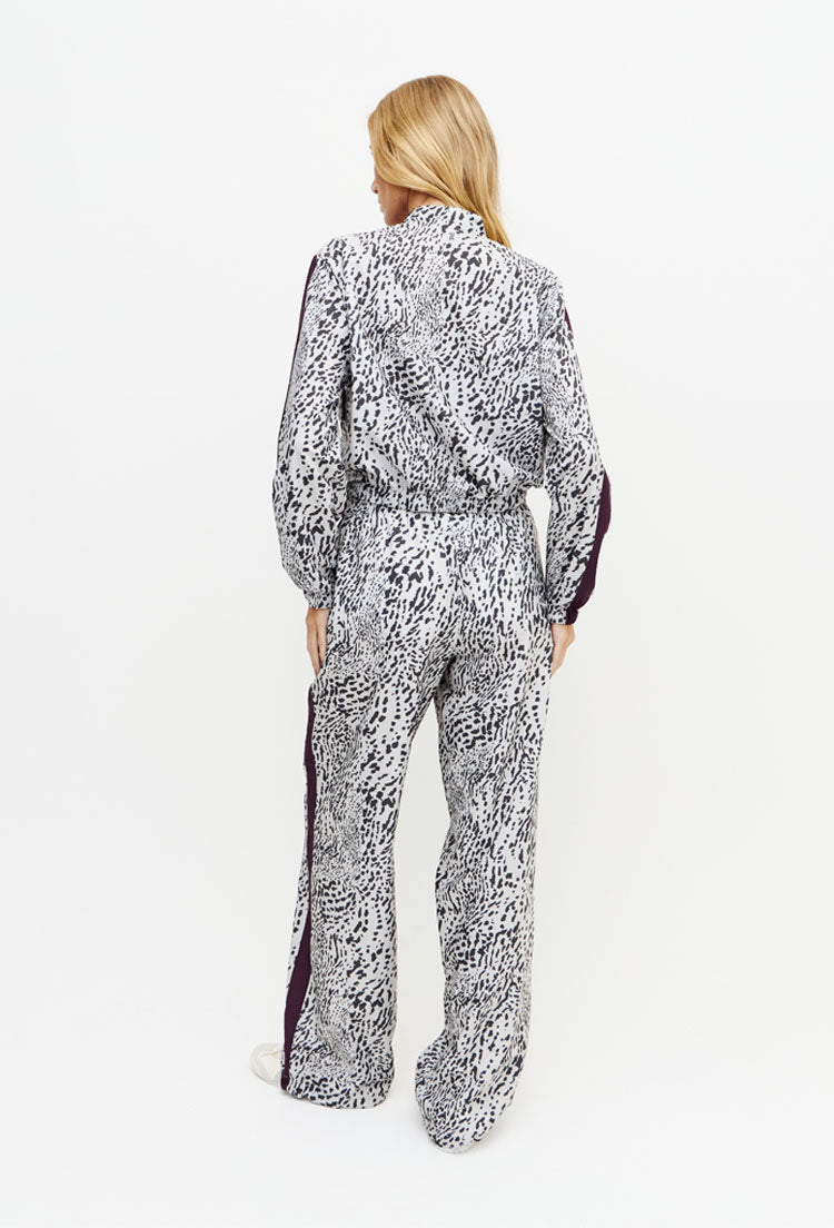 Calça wide leg estampada com faixa lateral e bolsos Instinto